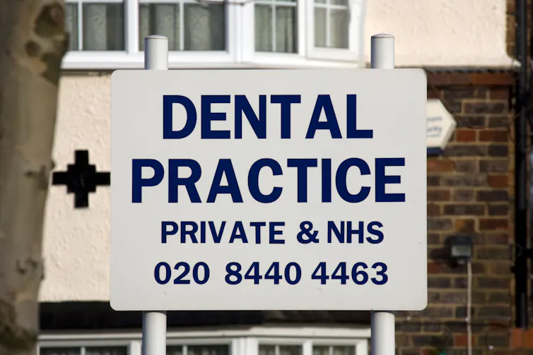 A dental practice sign, advertising both private and NHS services.
