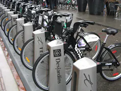 Bicycles seen in a bike sharing rack.
