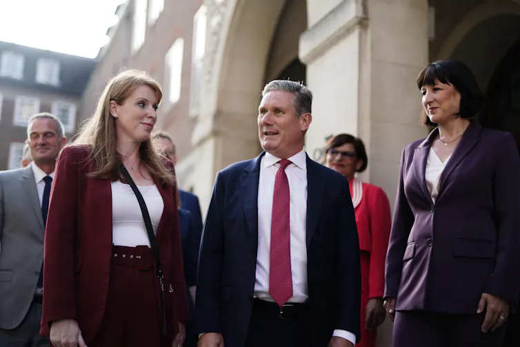 Angela Rayner, Keir Starmer and Rachel Reeves talking to each other.