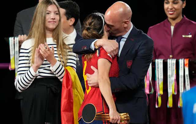 President of Spain's soccer federation, Luis Rubiales, embraces Spain's Aitana Bonmati