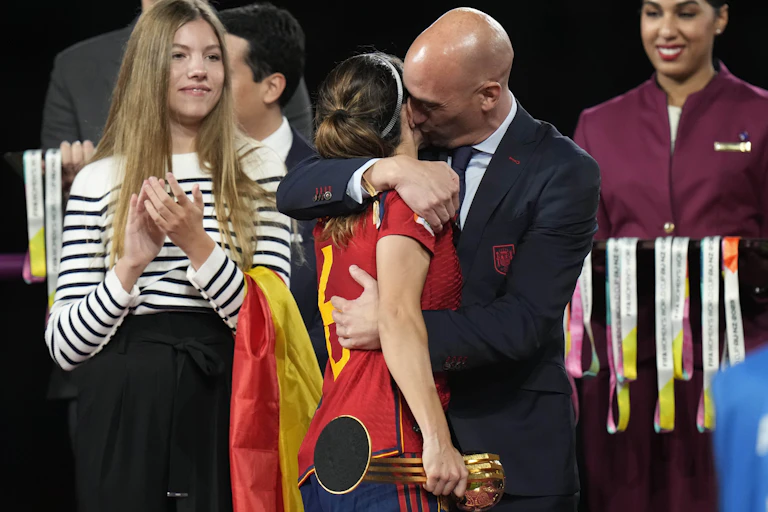 President of Spain's soccer federation, Luis Rubiales, embraces Spain's Aitana Bonmati