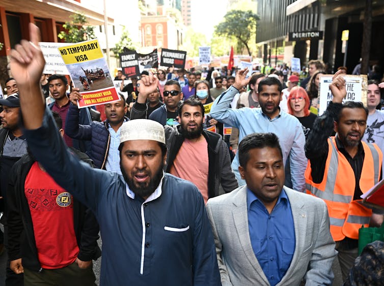 Protesters take part in a rally for refugees in Sydney