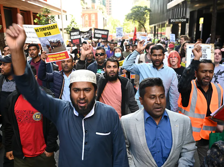 Protesters take part in a rally for refugees in Sydney