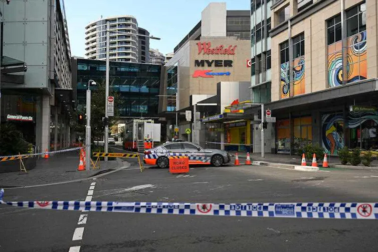 The exterior of a Westfield shopping centre behind police tape