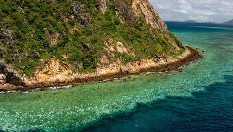 A reef showing signs of bleaching when seen from the air.