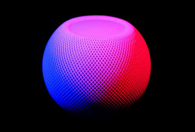 A round mesh pod in blue and red lighting on a black background.