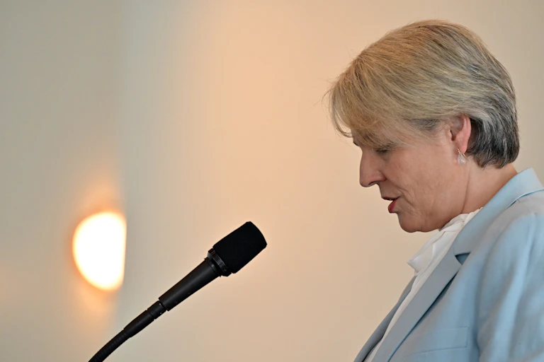 woman speaking at microphone, environment minister tanya plibersek
