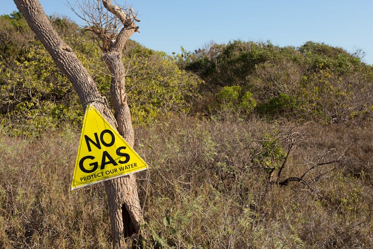 sign saying no gas on grassland
