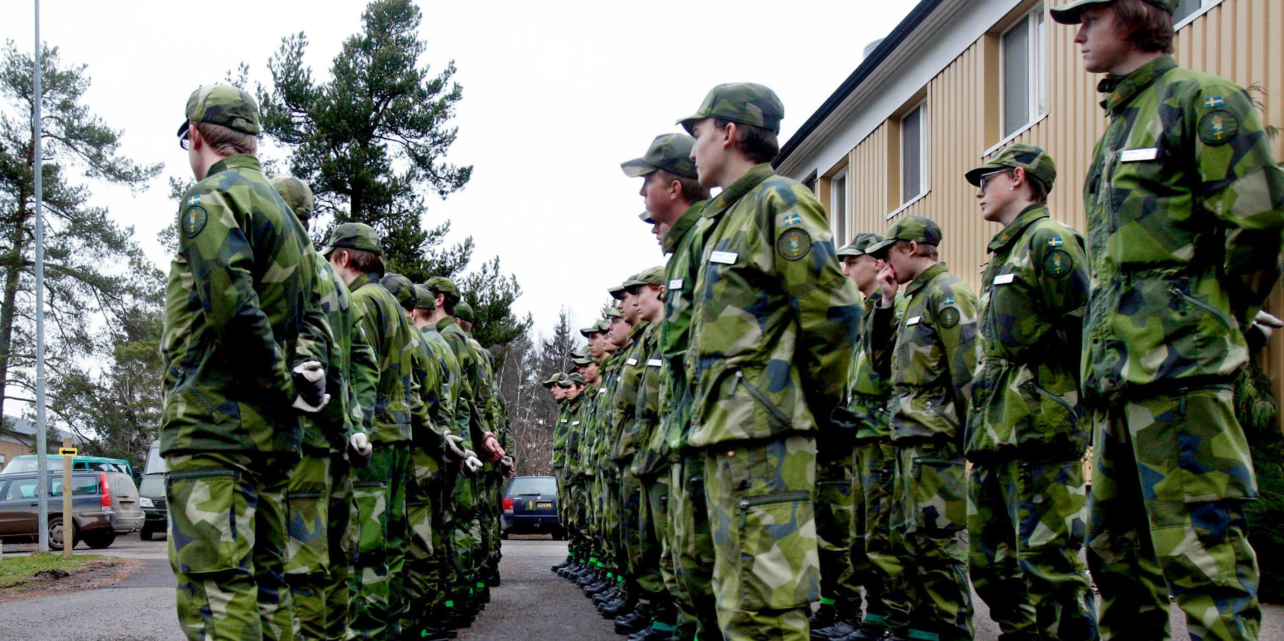 Swedish conscripts stand in line.
