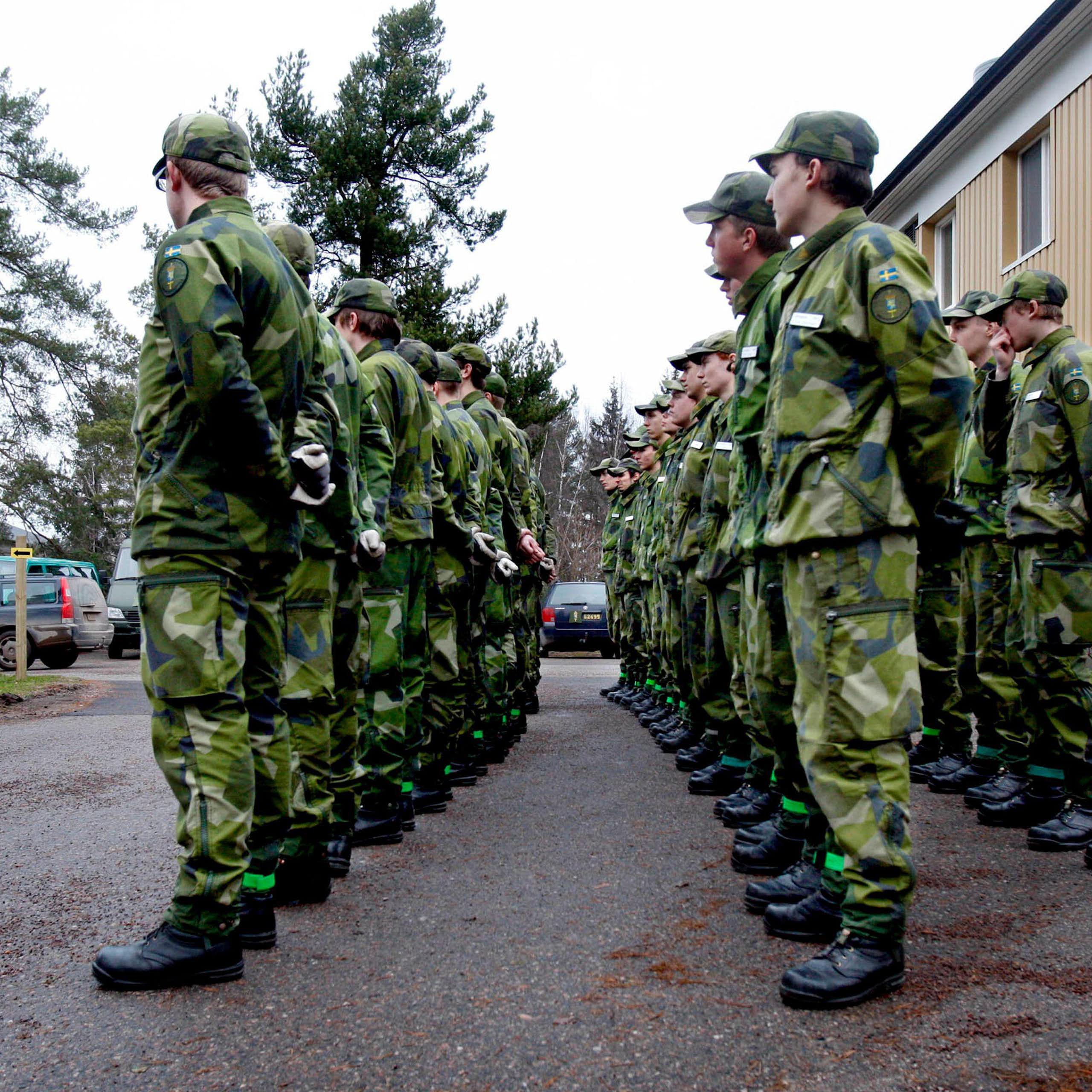 Swedish conscripts stand in line.