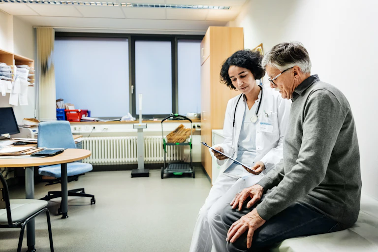 A female doctor and male patient in a surgery
