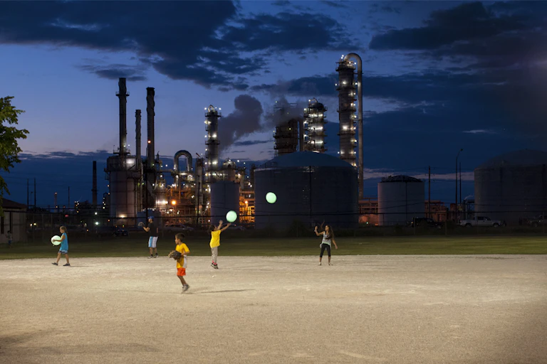 Children play on a baseball field.