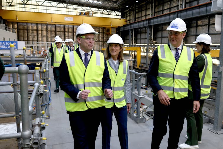 Richard Marles visits a shipyard with British and American officials.