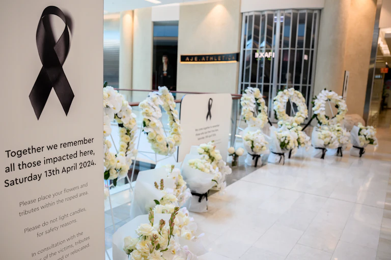 A floral memorial is laid at Westfield Bondi Junction shopping centre