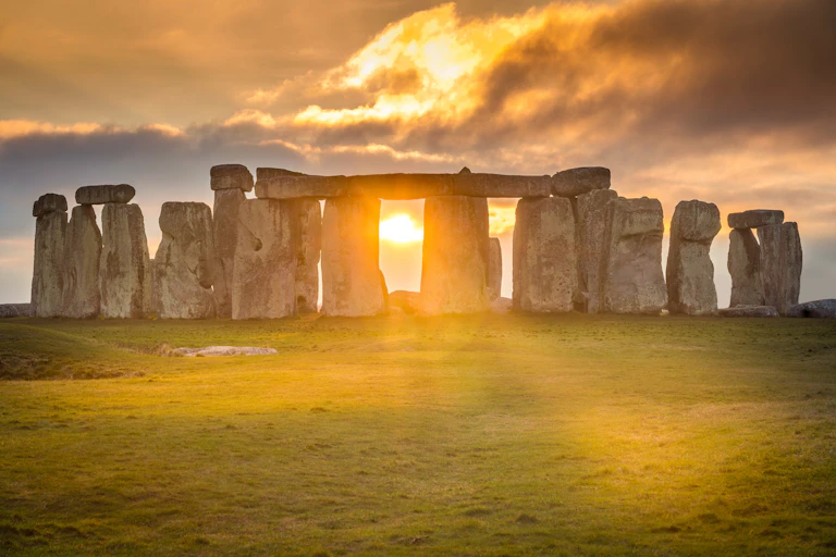 Sun shines through huge stone pillars