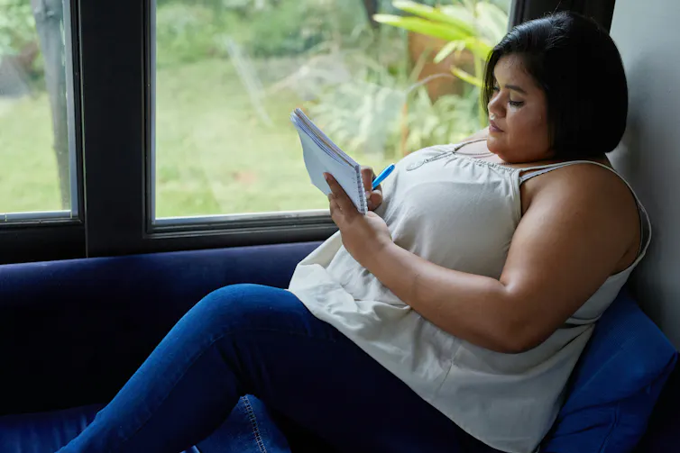 A woman writing poetry
