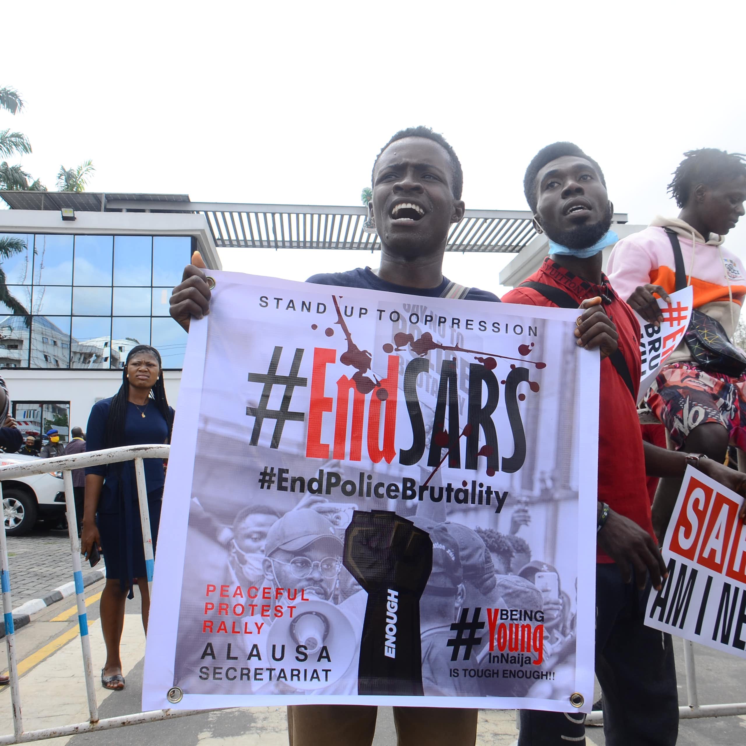 A group of young people with placards