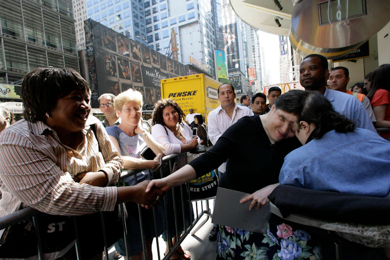 Lori and George Schappell greeting the public in Times Square, New York