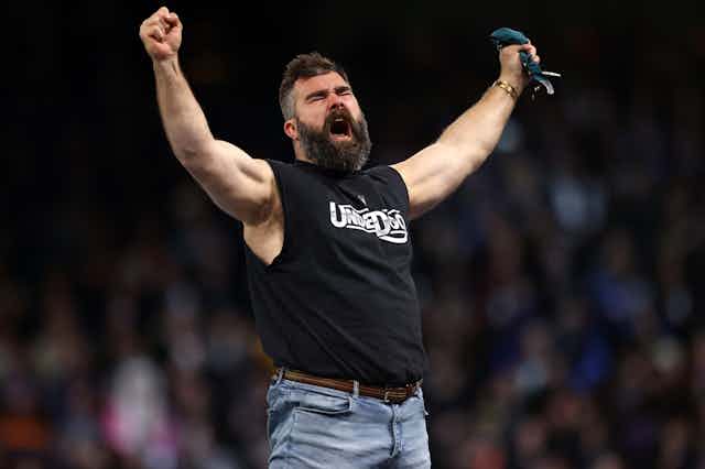 Former NFL player Jason Kelce reacts following a match during Night One of WrestleMania 40 in Philadelphia