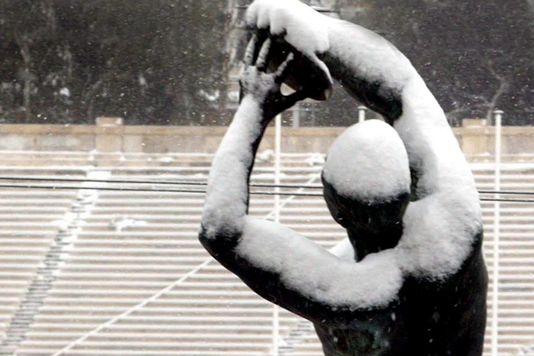 A statue of a discus thrower stands in Athens' Panathinean stadium, where the first modern Olympic games were held
