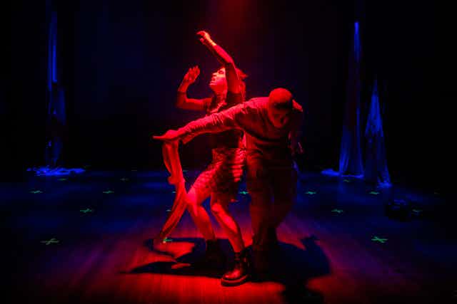 Two actors in red light