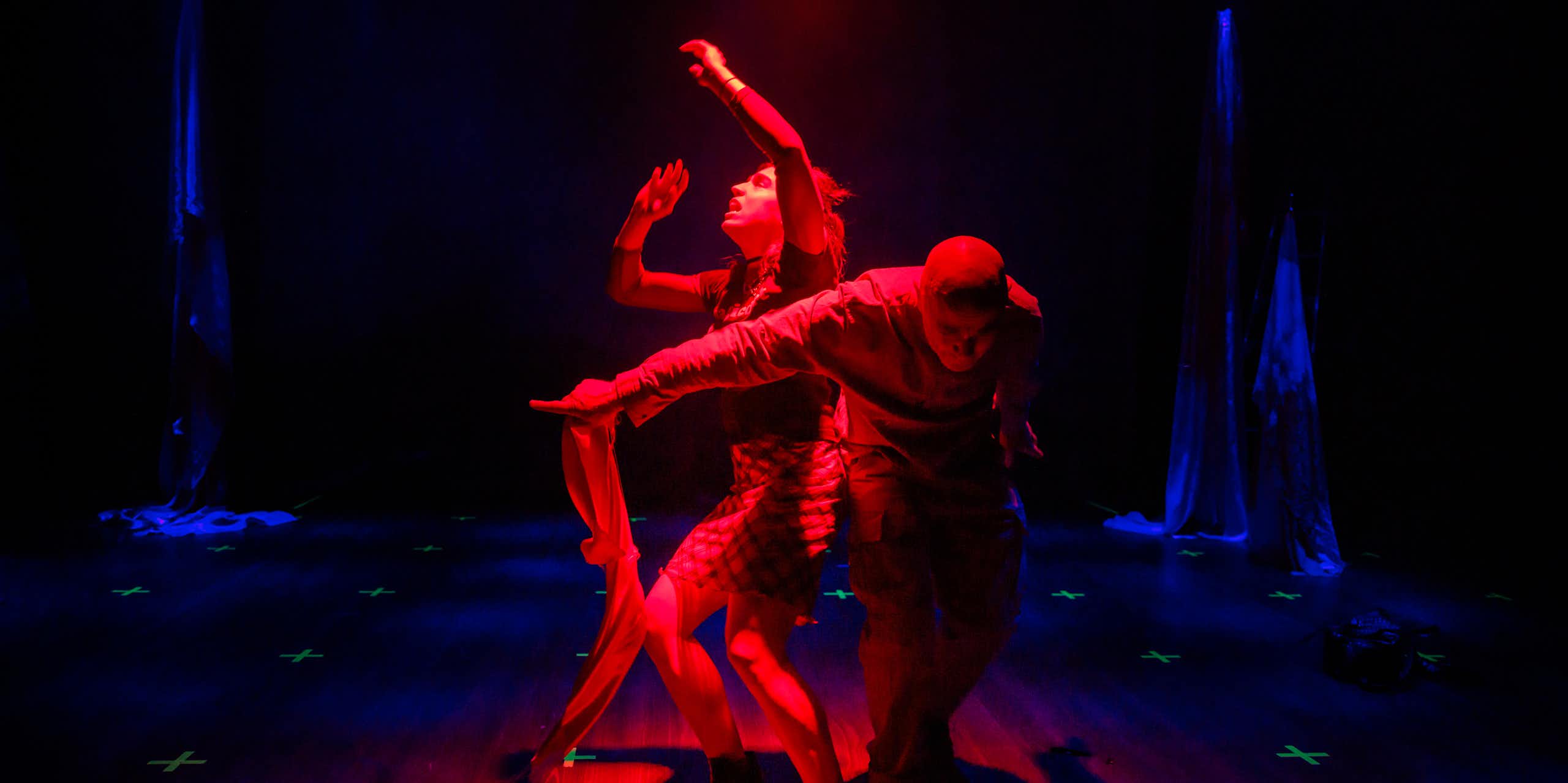 Two actors in red light