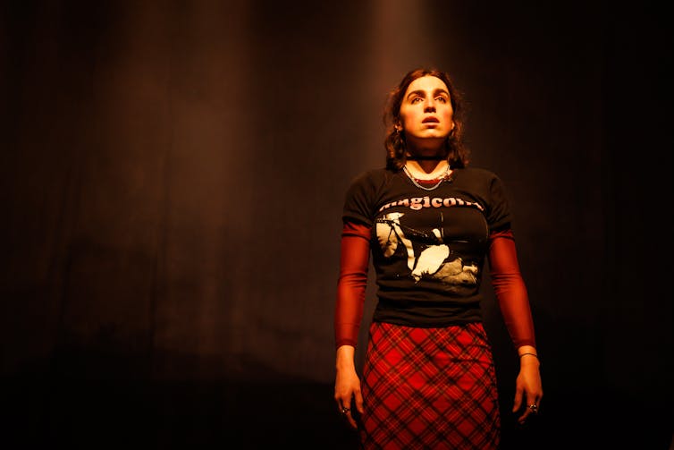 A young woman on stage.