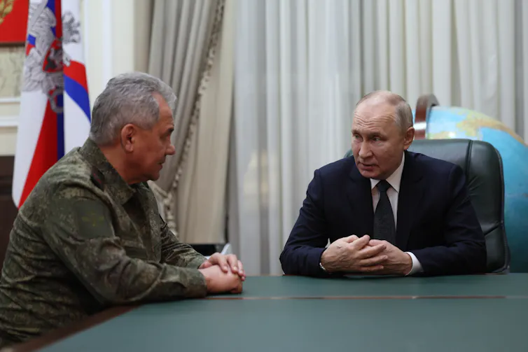 Russian president, Vladimir Putin, with defence minister, Sergei Shoigu.