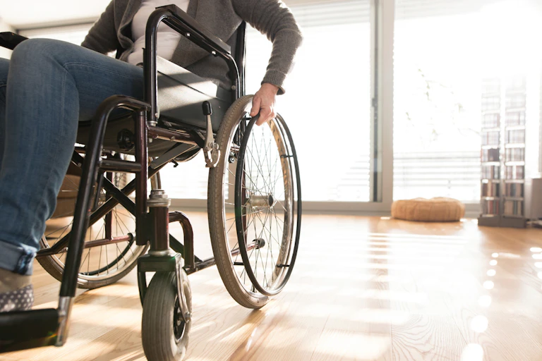 unidentifiable woman in a wheelchair