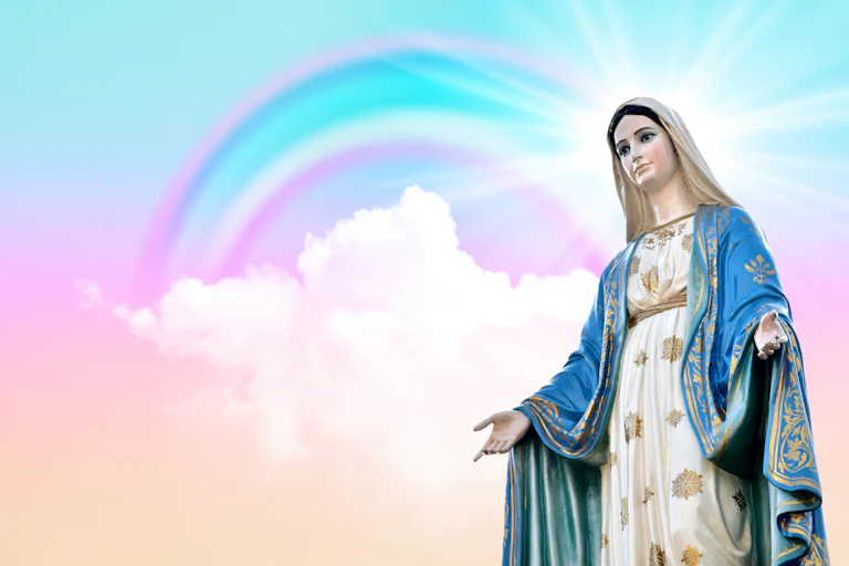 Image of Virgin Mary surrounded by pink and blue sky and rainbow.