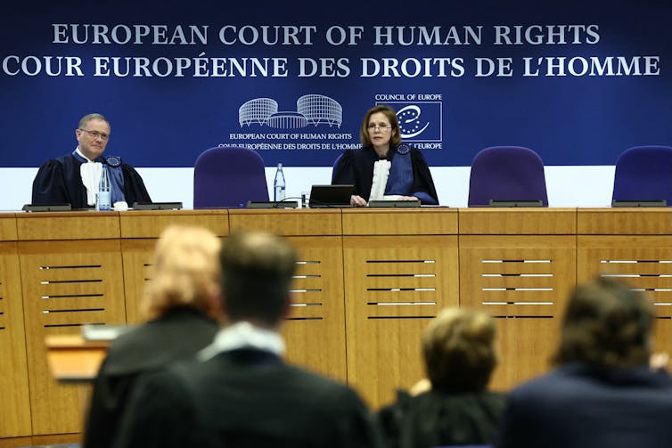 Two judges at the bench of the European Court of Human Rights