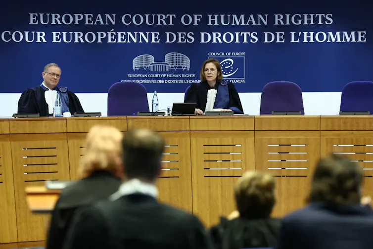 Two judges at the bench of the European Court of Human Rights