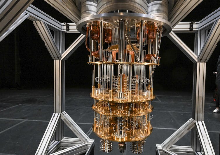 Photo of the elaborate copper pipe cooling system of a quantum computer.