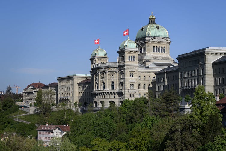 Swiss parliament building on sunny blue day