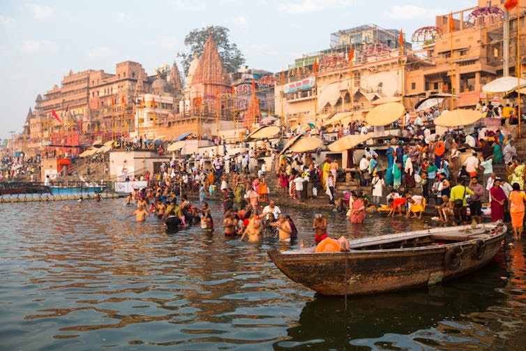 People bathing in the Ganges River in Varanasi, India.