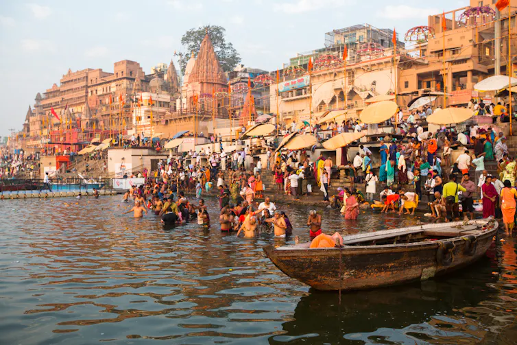 People bathing in the Ganges River in Varanasi, India.