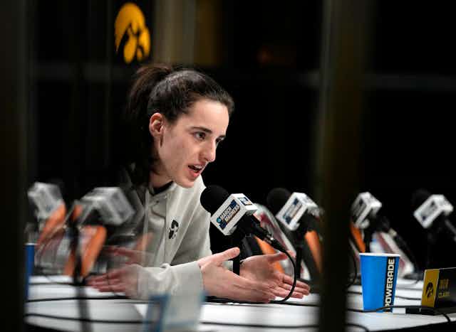 Iowa basketball star Caitlin Clark speaks during a press conference