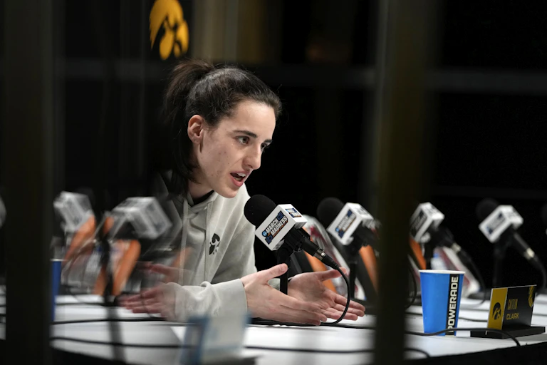 Iowa basketball star Caitlin Clark speaks during a press conference