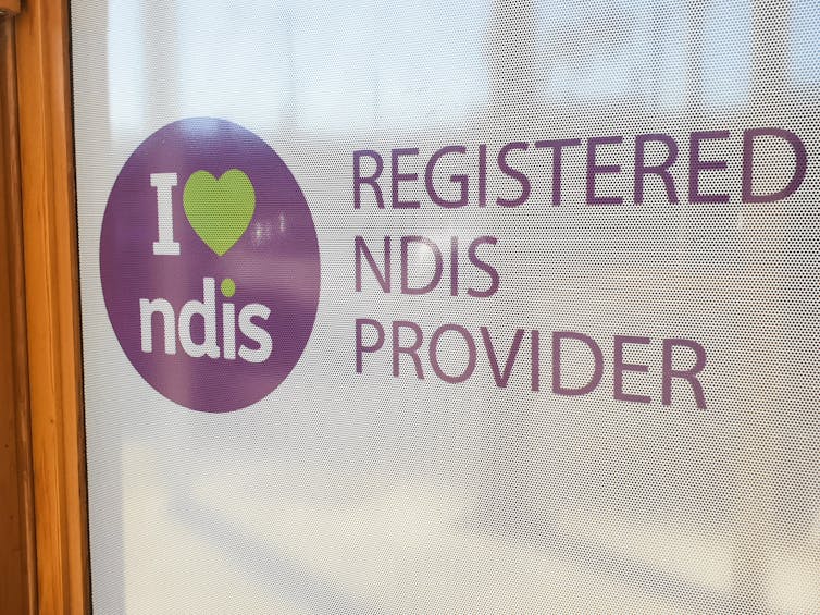 sign on window reads: I heart NDIS Registered NDIS Provider