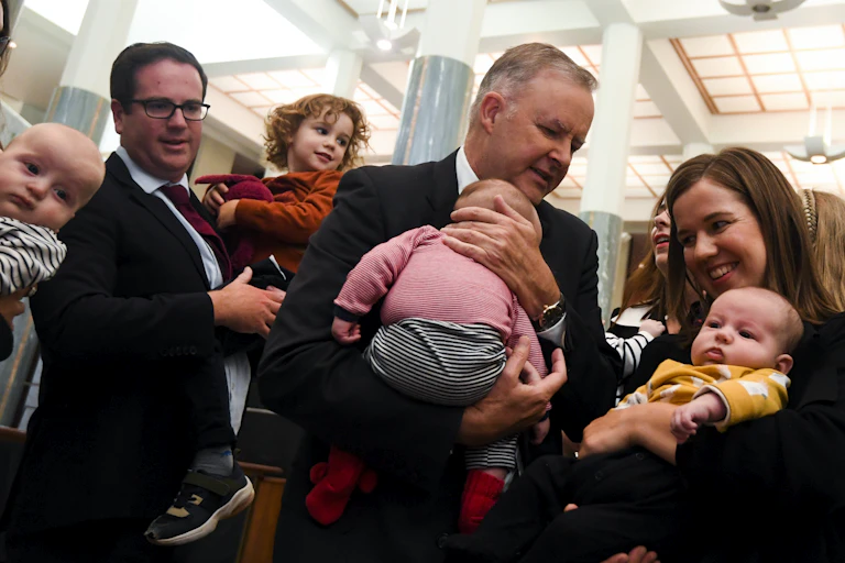 Photo of Prime Minister Anthony Albanese holds baby