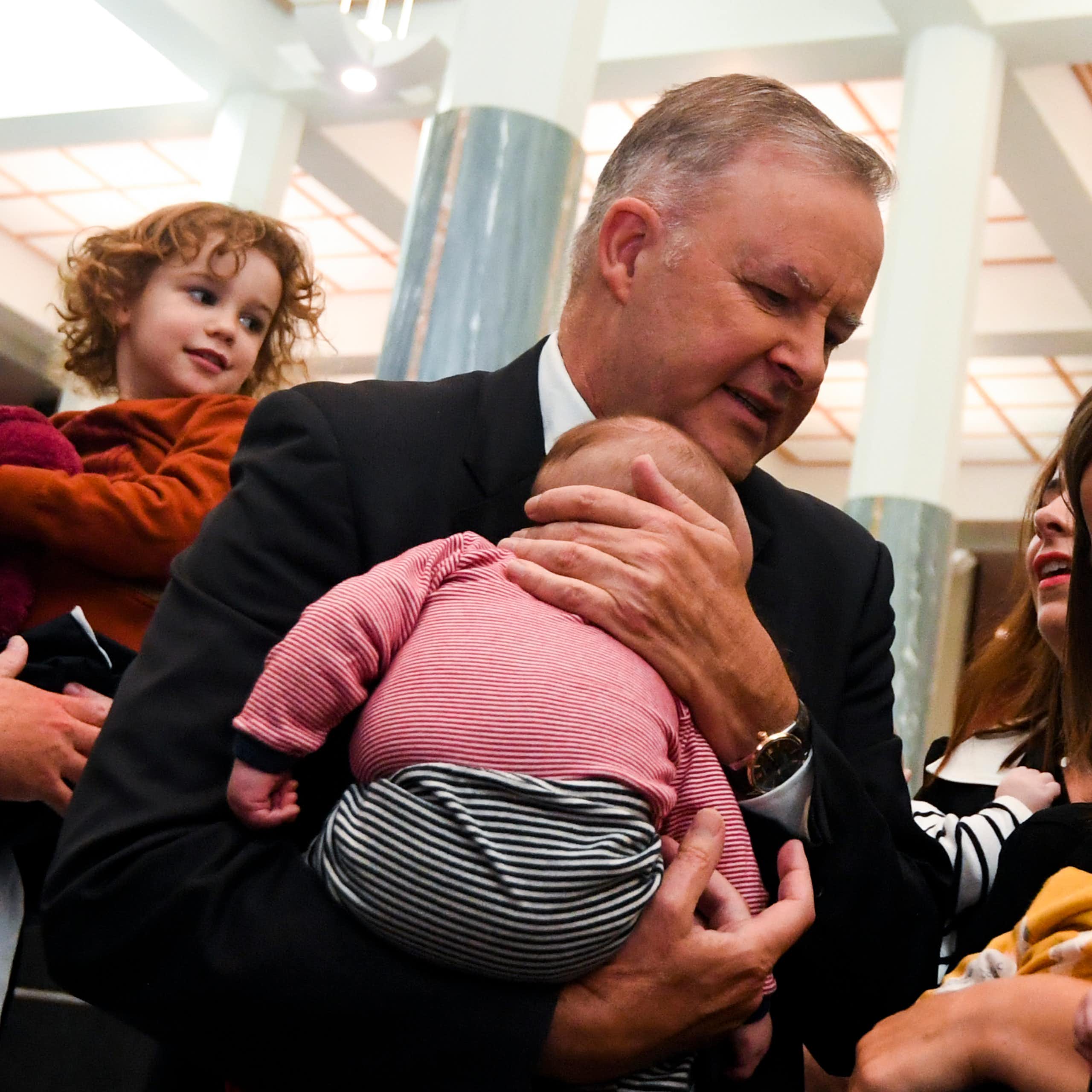 Photo of Prime Minister Anthony Albanese holds baby 