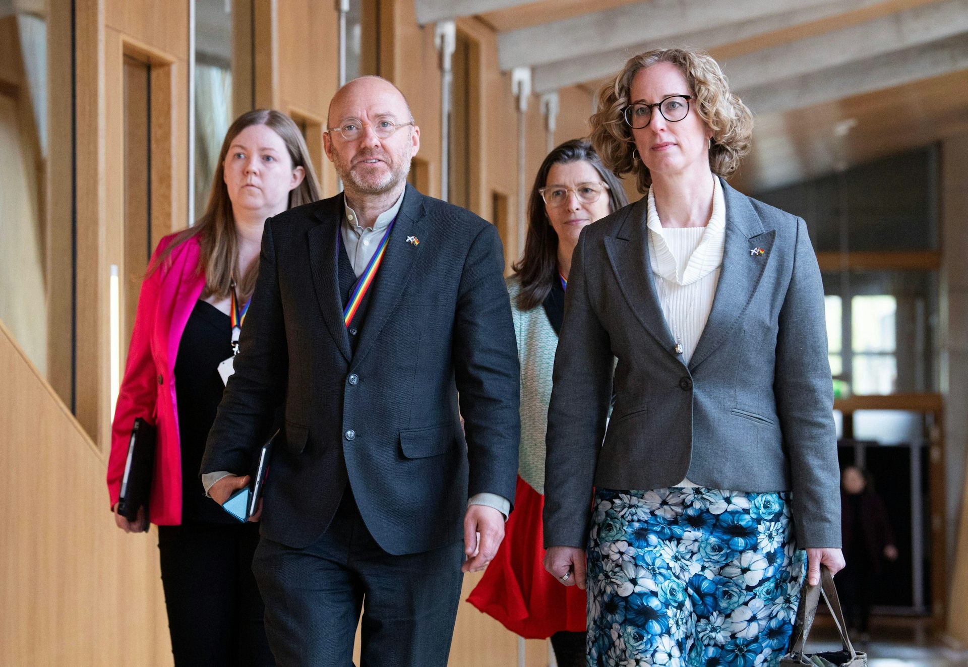 Scottish Green Party MSPs pictured walking through Holyrood.