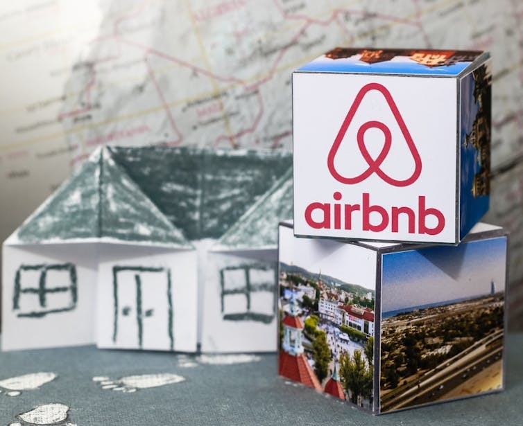 Airbnb logo next to some paper boxes