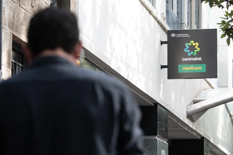 Man standing out front of a Centrelink office