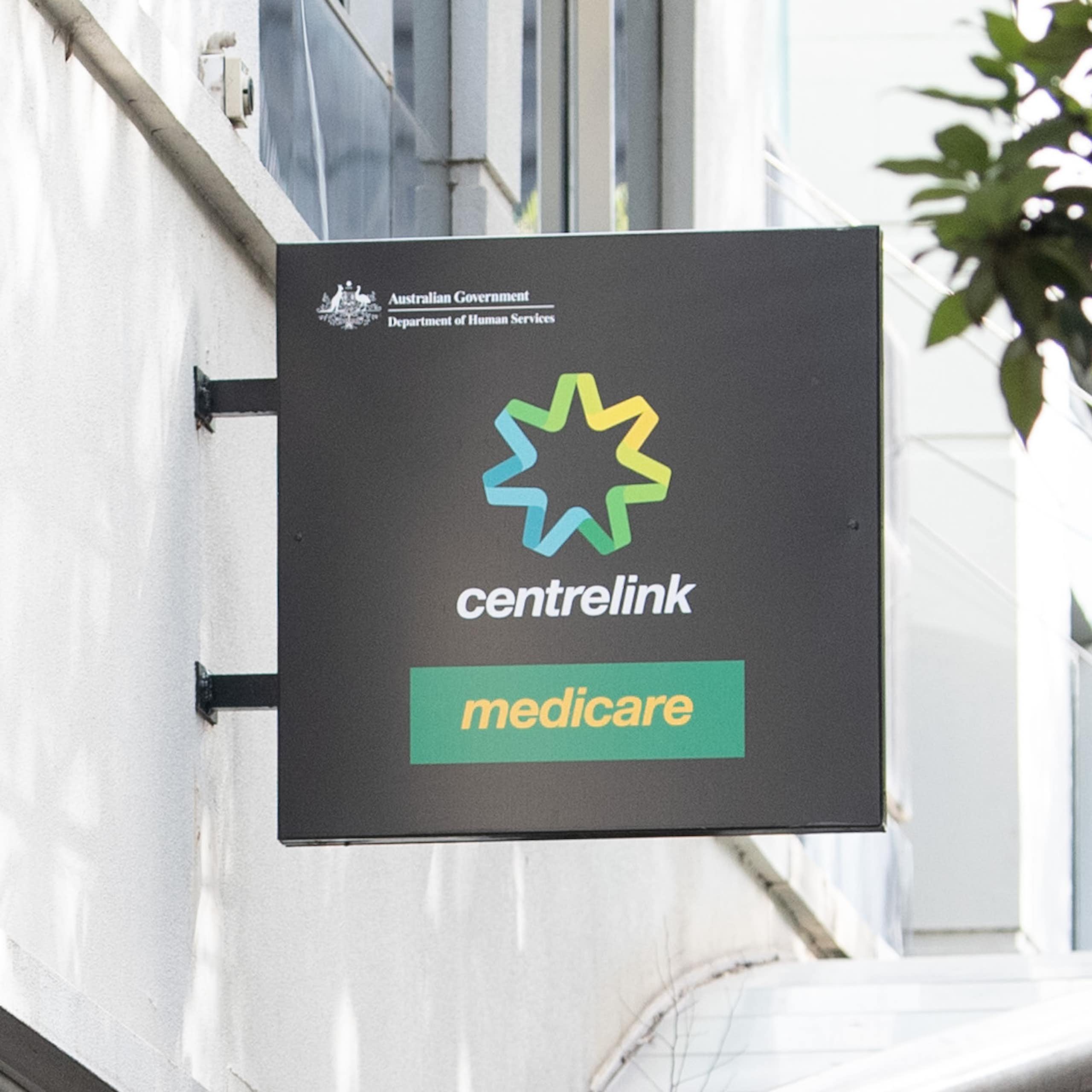 Man standing out front of a Centrelink office