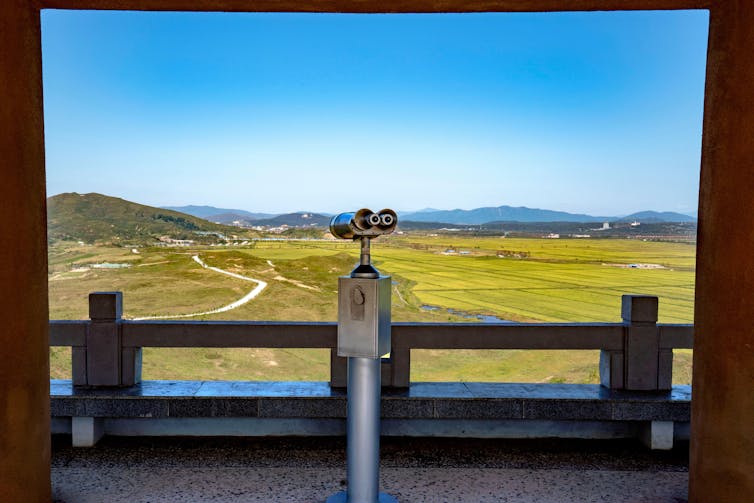 A telescope looking out over open land at the borders of North Korea, China and Russia.