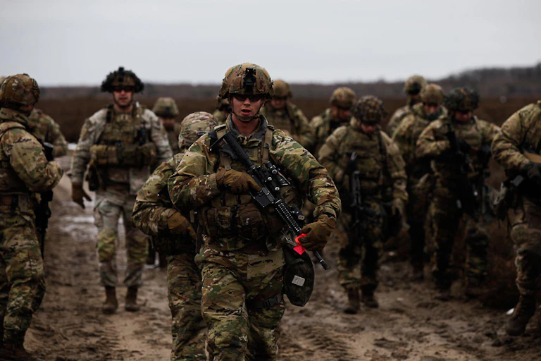 US soldiers running towards the camera.