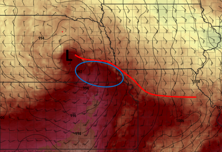 A chart map of wind direction and temperature shows the warm front across Nebraska and Iowa where the tornadoes developed.