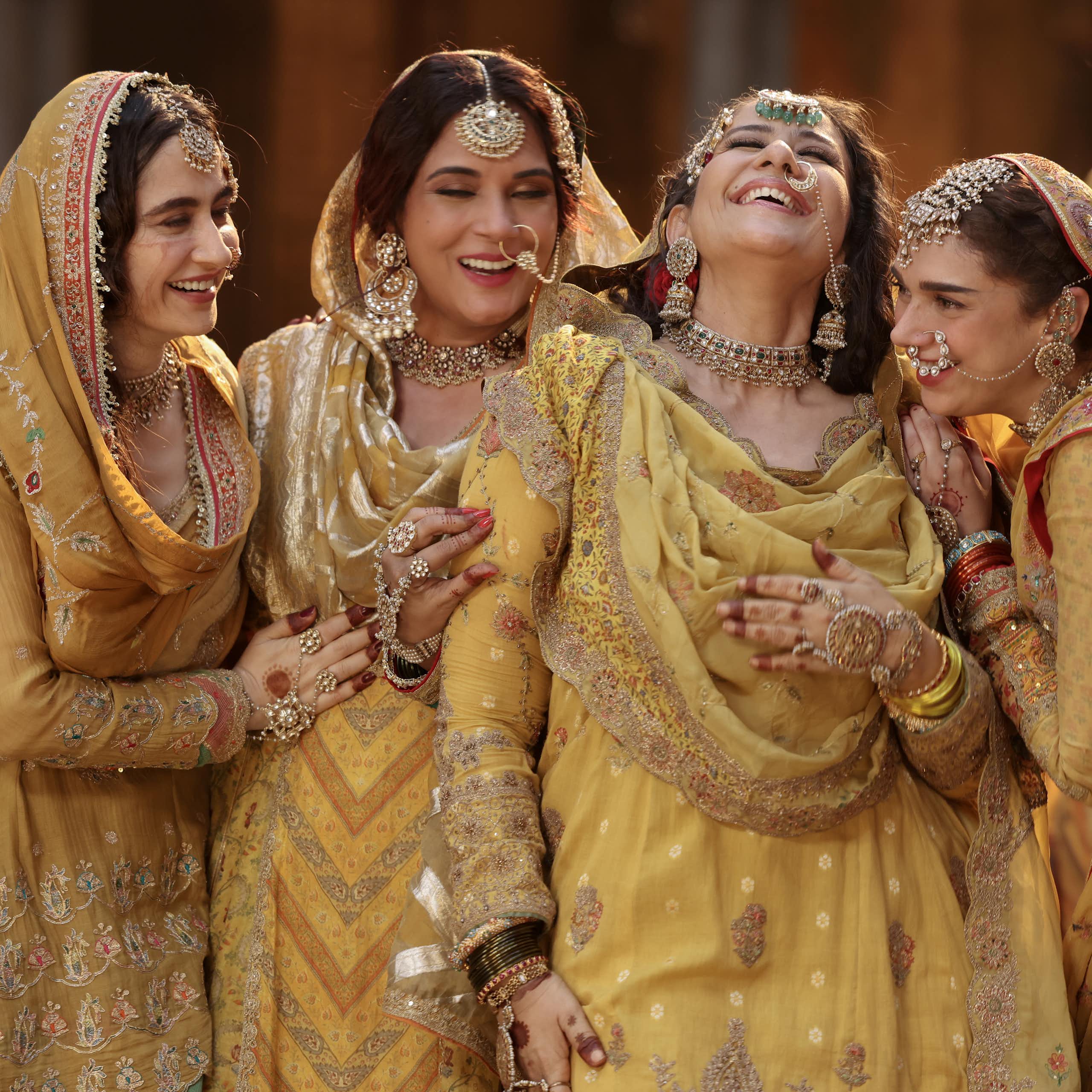 Indian women dressed in gold