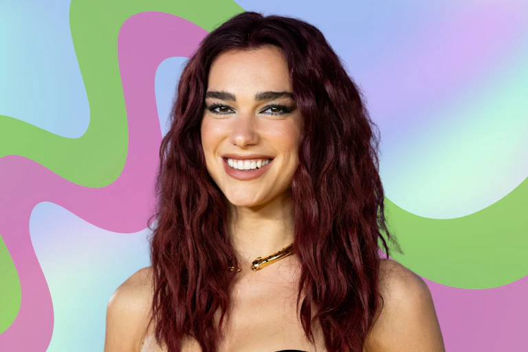 Dua Lipa smiling with a pattern behind her